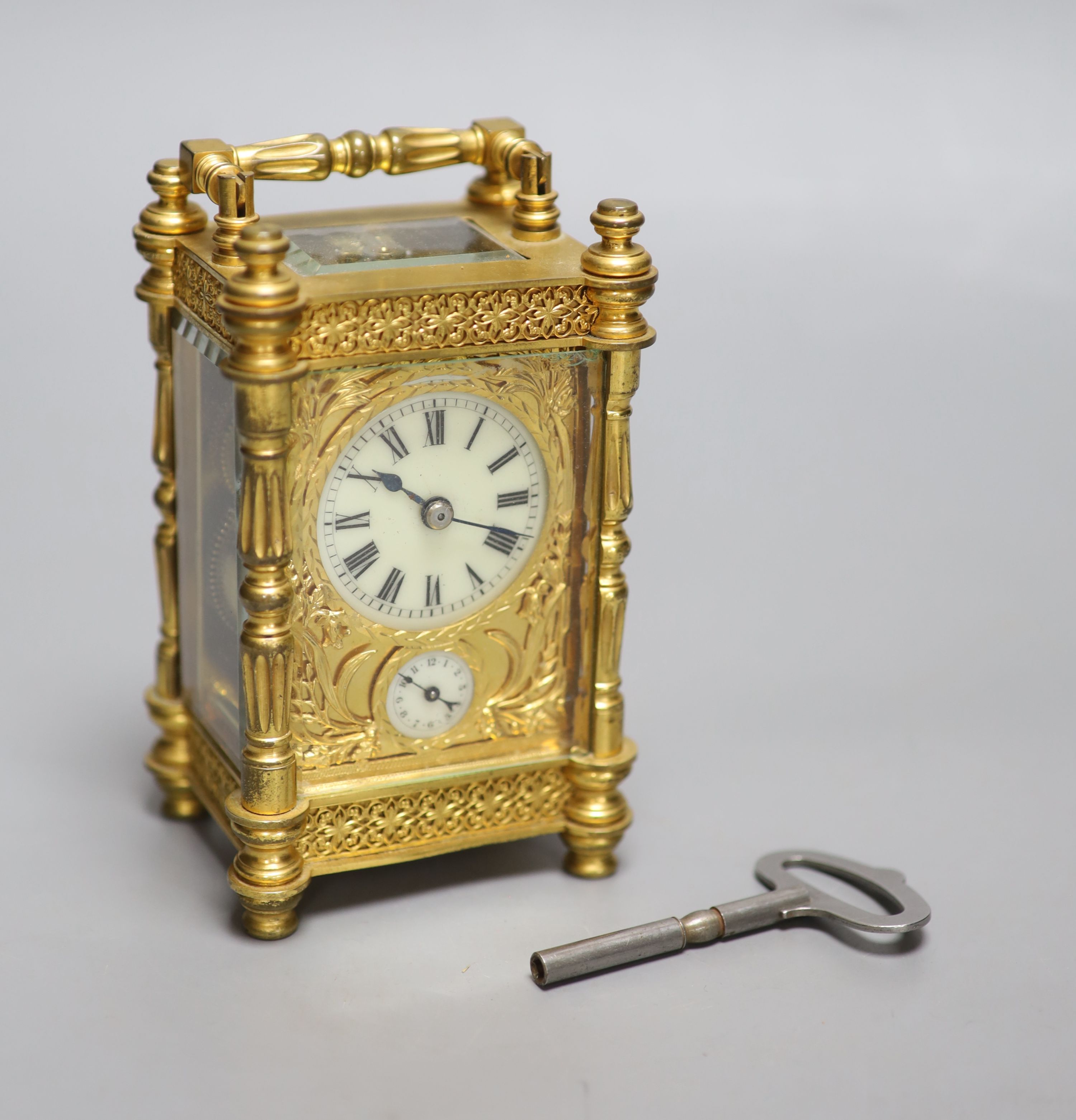 An early 20th century French brass carriage clock, with alarm, height 13.5cm with handle down